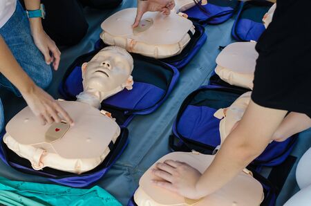 CPR training chest compressions for first aid  in emergency.の写真素材