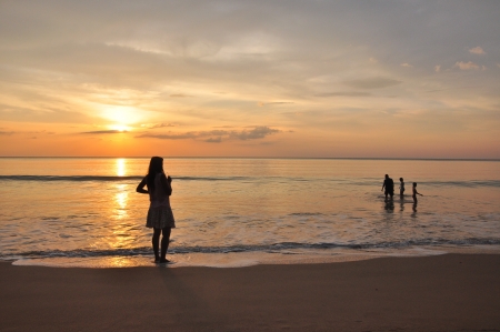 Family relaxed and fun in Sea Sunset の写真素材