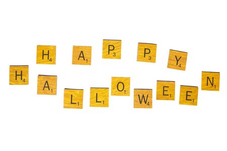 Happy Halloween word on wooden texture isolated on white backgroundの写真素材