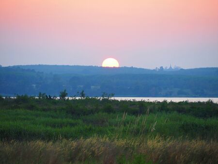 nice sunset on a mountain lakeの写真素材