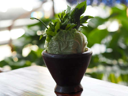 Wood mortar vegetablesの写真素材