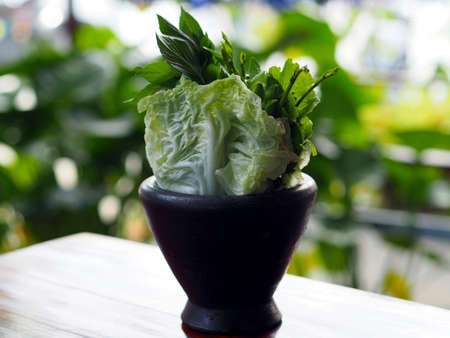 Wood mortar vegetablesの写真素材