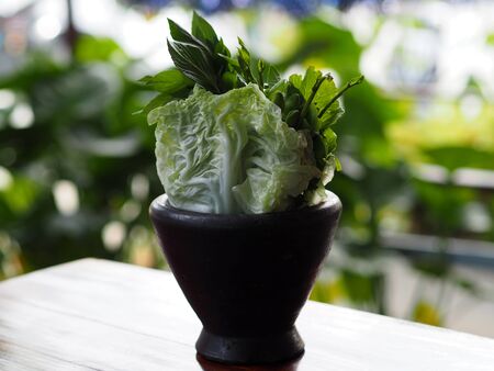 Wood mortar vegetablesの写真素材