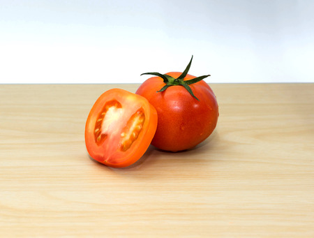fresh tomatoes on wooden background.の写真素材