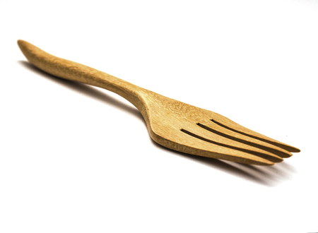 wooden fork on white isolate.の写真素材