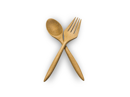 wooden spoon and fork on white isolate.の写真素材