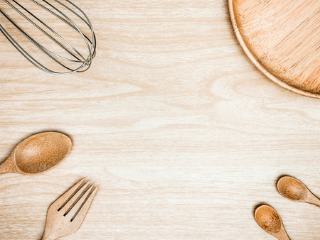 Utensil Kitchen Wooden and stainless whisk for cooking on wooden background. Top view white copy space.の写真素材
