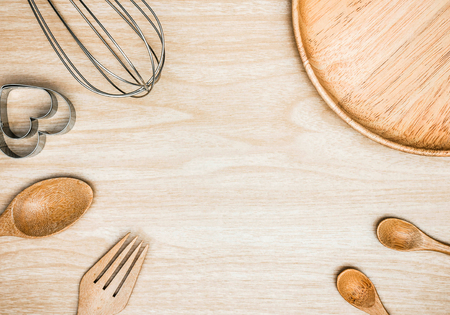 Utensil Kitchen Wooden and stainless whisk for cooking on wooden background. Top view white copy space.の写真素材