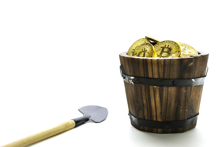 Bitcoin Mining, Golden bitcoins in hand. Digital symbol of a new virtual currency on isolate background.の写真素材