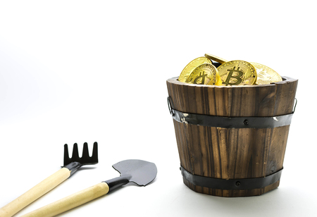 Bitcoin Mining, Golden bitcoins in hand. Digital symbol of a new virtual currency on isolate background.の写真素材