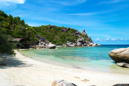 The beach with blue sea and stone at Koh Chang island in Thailandの写真素材