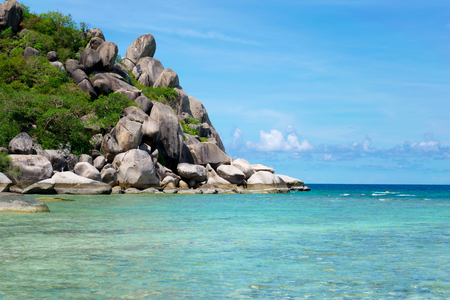 The stone on the beach with blue sea at Koh Chang island in Thailandの写真素材