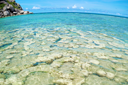 The stone on the beach with blue sea at Koh Chang island in Thailand, with fisheye lensの写真素材