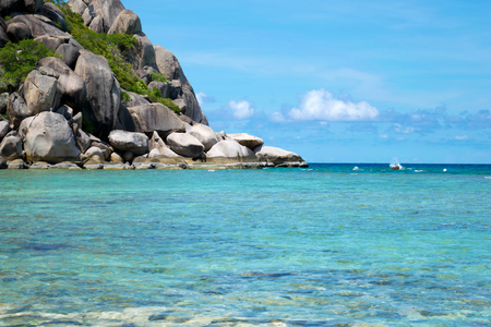The stone on the beach with blue sea at Koh Chang island in Thailandの写真素材
