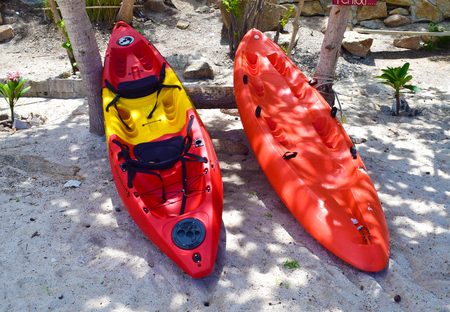 Two red color of Kayak on the beach stand by for Adventuの写真素材