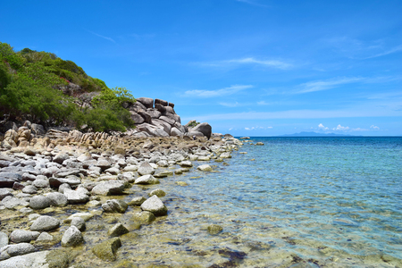 The stone on the beach with blue sea at Koh Chang island in Thailandの写真素材