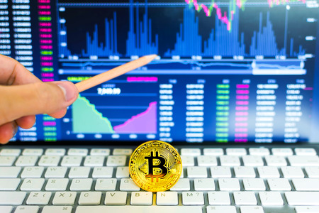 Gold bitcoin and trading chart background. Virtual currency concept.の写真素材