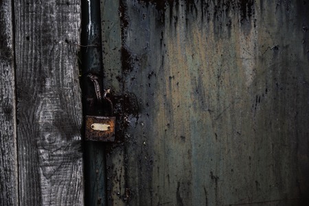 Close-Up Of Old Green Door With Rusty Lockの写真素材