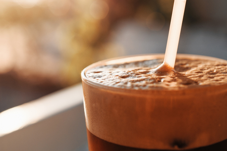 Iced Coffee In Tall Glass With Foam And Bubblesの写真素材