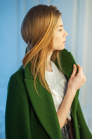 Young woman portrait. Shape and fit body beauty studio shoot. Healthy clean skin and perfect makeup on beautiful face of white model with short blonde hair. Beautiful girl. Posing fashion model.の写真素材