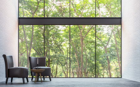 Modern loft living room with nature view 3d rendering image Furnished with dark brown leather and black wood furniture has white brick walls and large windows look out to nature.の写真素材