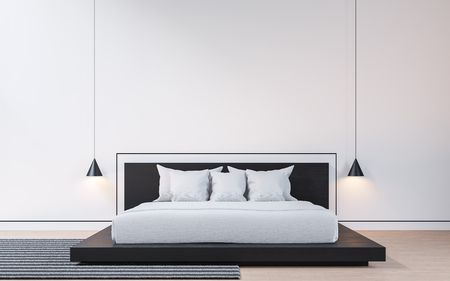 Modern bedroom with black and white 3d rendering image . There are wood floor White walls decorated with black grooves. Furnished with black wooden beds and white mattresses.の写真素材