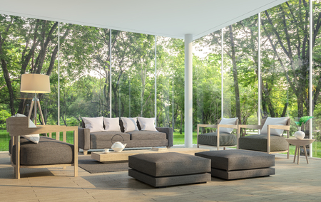 Modern living room with garden view 3d rendering Image.There are large window overlooking the surrounding garden and nature and finished with dark brown furnitureの写真素材