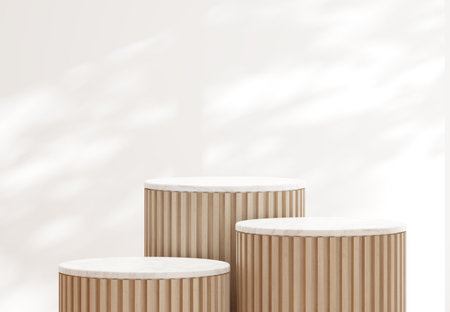 Minimal style luxury cylinder podium with wooden slats and white marble top on white wall with tree shadow background for product presentation 3d render illustration.の写真素材
