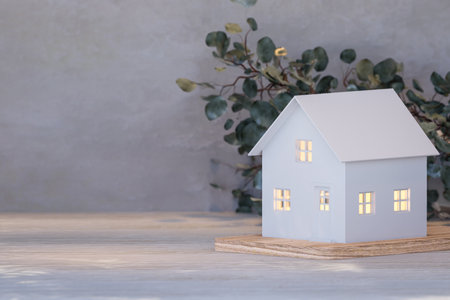 Simple style white tiny house architecture model on table top with concrete wall background 3d render illustrationの写真素材