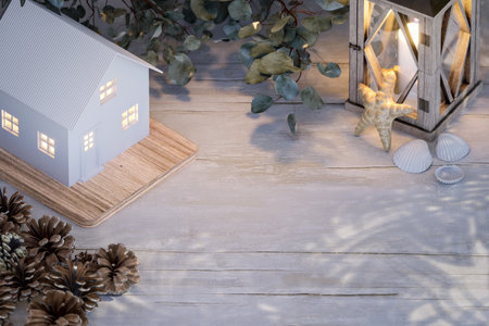 Aerial view Of simple style white tiny house architecture model on table top with copy space 3d render illustration Decorated with vintage style items.の写真素材