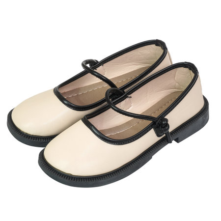 Black and white shoes with a classic round toe, durable sole, and a striking isolated on white background. Perfect for fashion, footwear, and styles for kids.の写真素材
