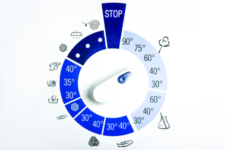 Blue pictograms controlling a washing machine on a white backgroundの写真素材