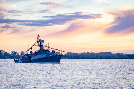 Warship on holiday at sunsetの写真素材