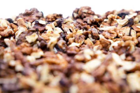 Peeled walnuts on a white background with blurred edgesの写真素材