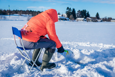 girl on winter fishingの写真素材
