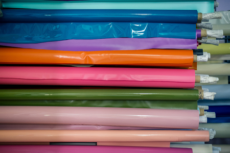Colored vinyl rolls on the shelvesの写真素材