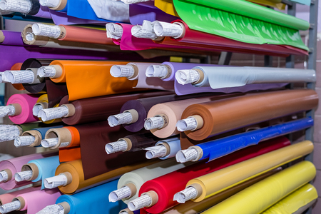Colored vinyl rolls on the shelvesの写真素材