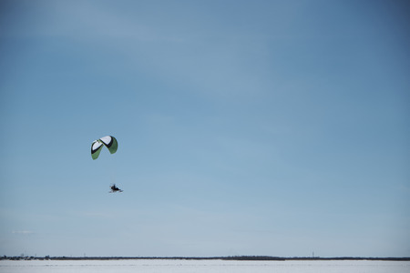 a steamer flying in a sunny winter day