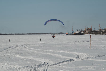 a steamer flying in a sunny winter dayの写真素材