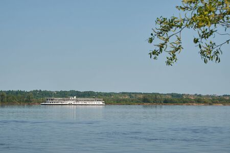 Old paddle steamer floats down the riverの写真素材