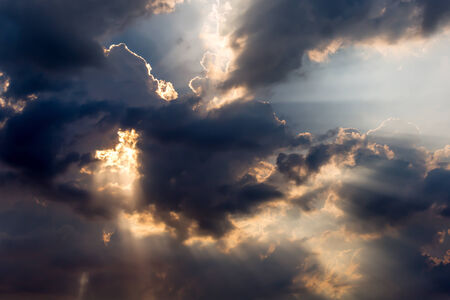 Stunning sun rays breaking through clouds