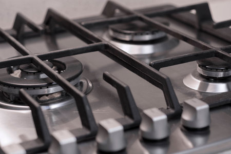 Close up of a cooker in stainless steel and cast ironの写真素材