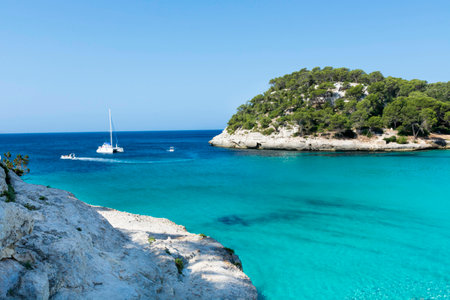 View of Macarella bay in Menorca During a summer day with blue sky transparent water, Balearic Islands, Spainの写真素材