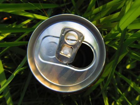 A CAN OPENNED ON GRASS の写真素材