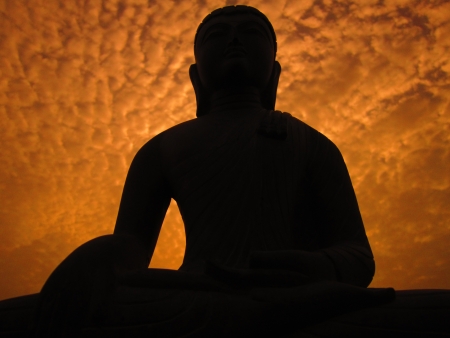 LORD BUDDHA AND ORANGE SKY の写真素材