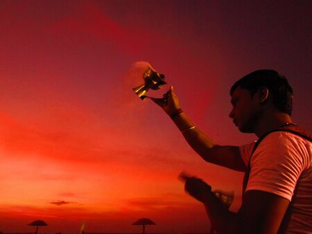 Priest performing Ganga or river Ganges worship at evening 1900 hours on the bank of river Ganges at Gandhighat, Patna, Bihar. Shot dated 21.07.2012.のeditorial素材
