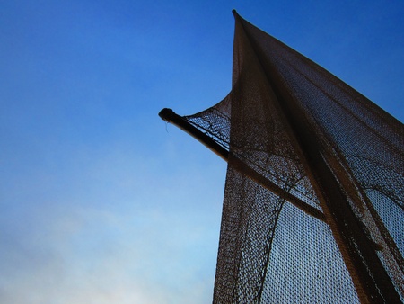 FISHNET ON COUNTRY BOAT AT SUNRISE.