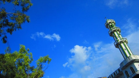 mosque in cloudy blue skyの写真素材