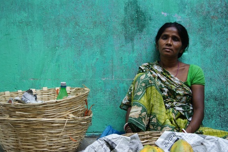 WOMAN SALESMAN AT ROAD SIDE. SHOT AFTERNOON HOURS 14.06.11 AT PATNA, BIHAR , INDIA.のeditorial素材