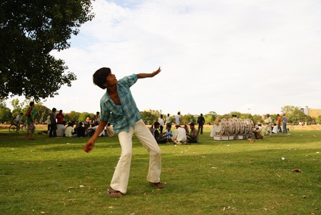 BOY THROWING BALL AT GANDHI MAIDAN. SHOT AT EVENING HOURS ON 17.06.11 AT PATNA, BIHAR, INDIA.のeditorial素材